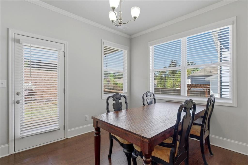 621 Little Bear Loop Canton, GA 30114 - Photo 14 of 45 a dining room with furniture and window