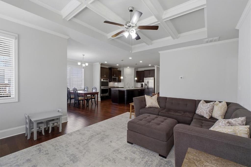 621 Little Bear Loop Canton, GA 30114 - Photo 17 of 45 a living room with furniture and kitchen view