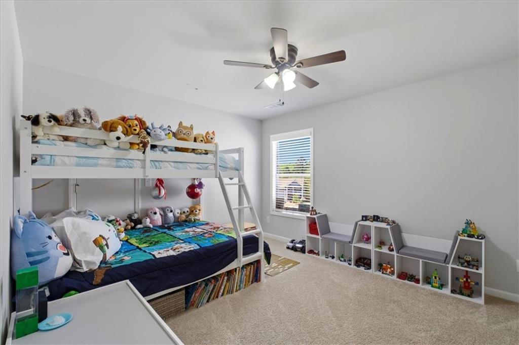 621 Little Bear Loop Canton, GA 30114 - Photo 28 of 45 a bed room with furniture and a window