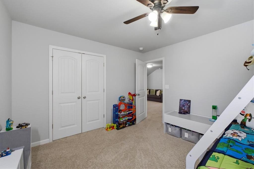 621 Little Bear Loop Canton, GA 30114 - Photo 29 of 45 a bedroom with furniture and baby crib