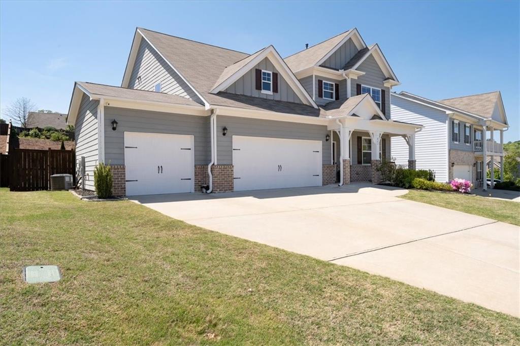 621 Little Bear Loop Canton, GA 30114 - Photo 3 of 45 a view of a white house with a outdoor space