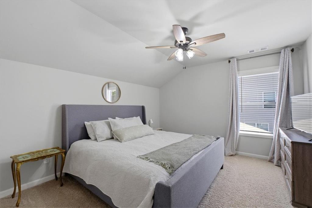 621 Little Bear Loop Canton, GA 30114 - Photo 31 of 45 a bedroom with a bed and a window