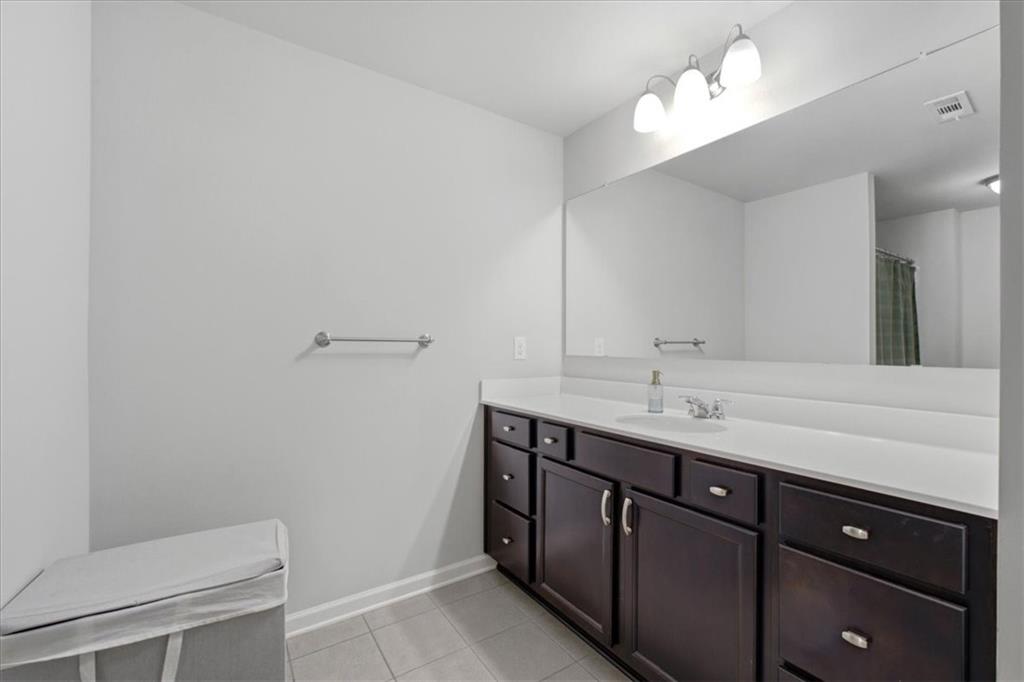 621 Little Bear Loop Canton, GA 30114 - Photo 33 of 45 a bathroom with a sink a toilet and a mirror