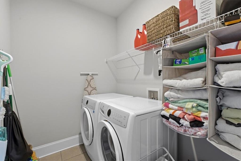 621 Little Bear Loop Canton, GA 30114 - Photo 35 of 45 a utility room with dryer and washer