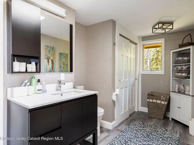 a en suite bathroom with a sink a mirror and a shower