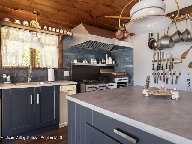 a kitchen with a large counter space cabinets and appliances