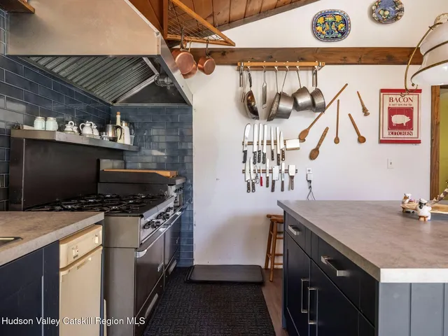 a kitchen with a stove and a microwave