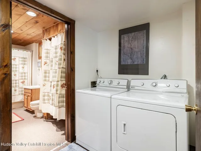 a view of bathroom with a sink and mirror