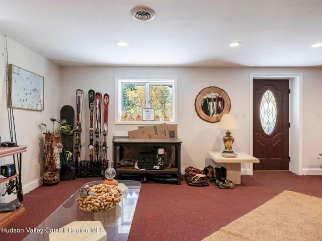 a living room with furniture a window and a fireplace