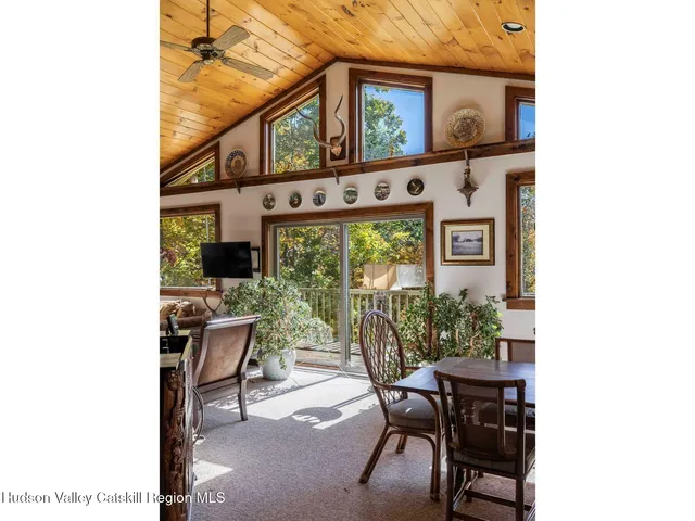 a dining room with furniture and a window
