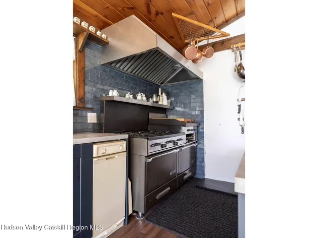 a kitchen with a stove and a microwave