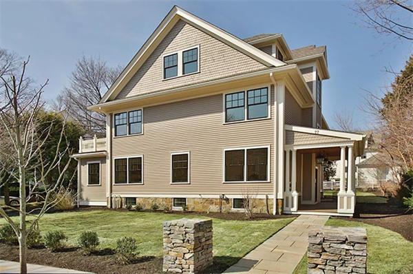 77 Salisbury Road Brookline, MA 02445 - Photo 1 of 11 a front view of a house with a yard