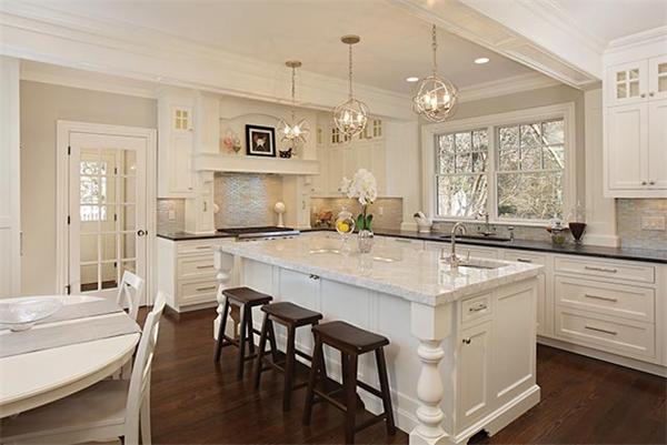 77 Salisbury Road Brookline, MA 02445 - Photo 4 of 11 a kitchen with center island table and chairs