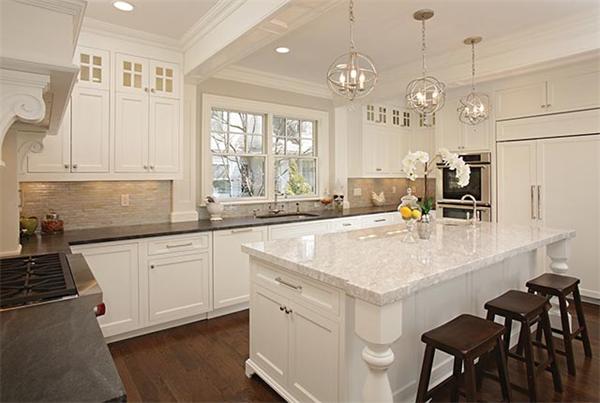 77 Salisbury Road Brookline, MA 02445 - Photo 5 of 11 a kitchen with stainless steel appliances granite countertop a sink a stove and a refrigerator