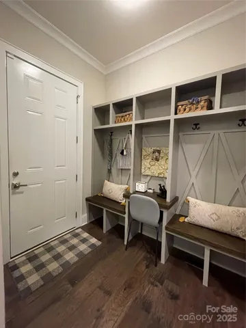 a bedroom with furniture and a window