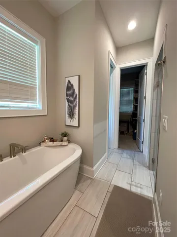 a bathroom with a bathtub and a sink