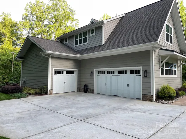 a front view of a house with a garage