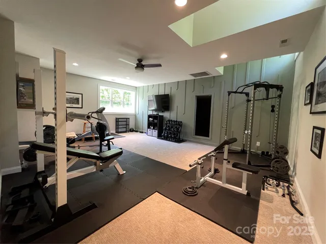 a room with gym equipment and a large window