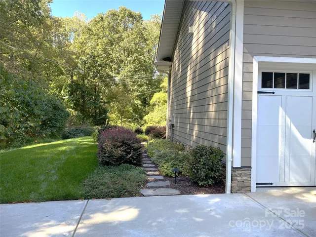 a view of a back yard from a room