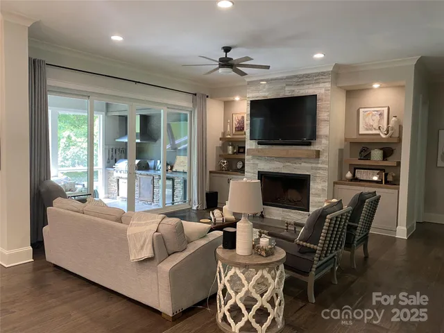 a living room with furniture fireplace and a flat screen tv
