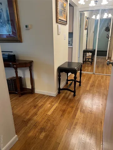 a view of a livingroom with furniture and wooden floor