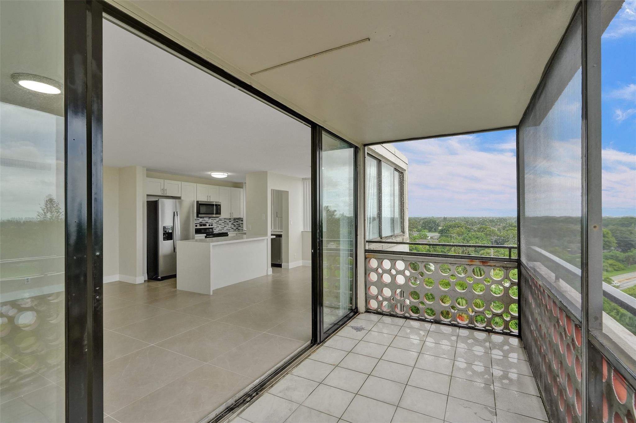 4222 Inverrary Boulevard, Unit 4810 Lauderhill, FL 33319 - Photo 25 of 63 a bathroom with a glass door shower and yard