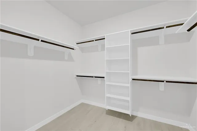 a view of an empty walk in closet