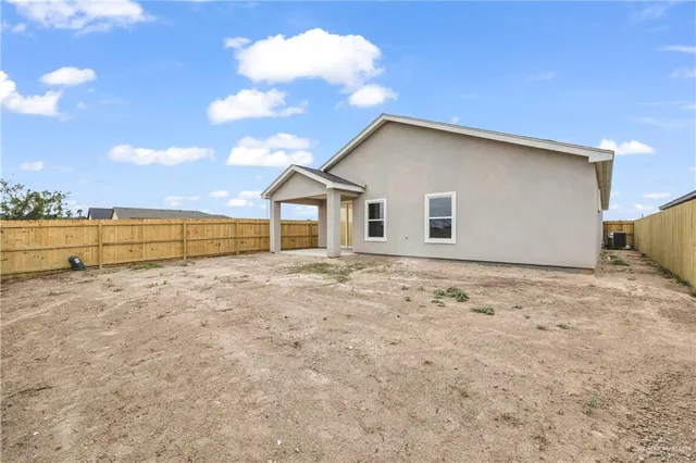 a house with trees in the background