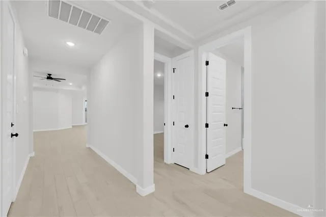 a view of a hallway with closet area