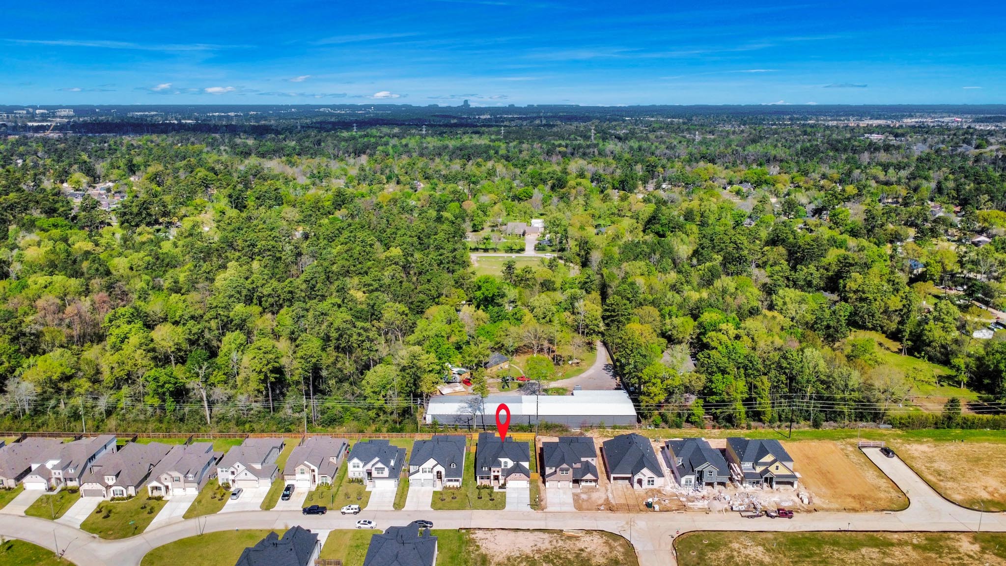 3023 Native Spg Drive Spring, TX 77373 - Photo 4 of 50 An aerial view of a spacious subdivision lot, highlighting a well-maintained yard and a fully fenced perimeter, offering both privacy and expansive outdoor space.
