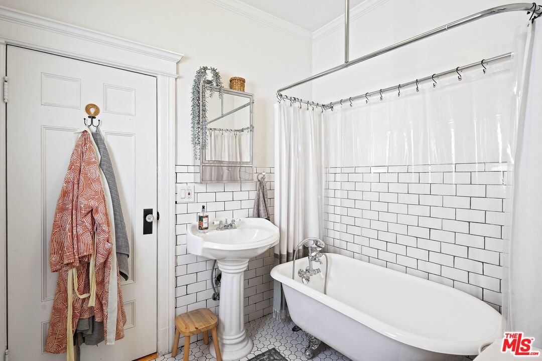 5159 Meridian Street Los Angeles, CA 90042 - Photo 15 of 41 a bathroom with a sink toilet and shower