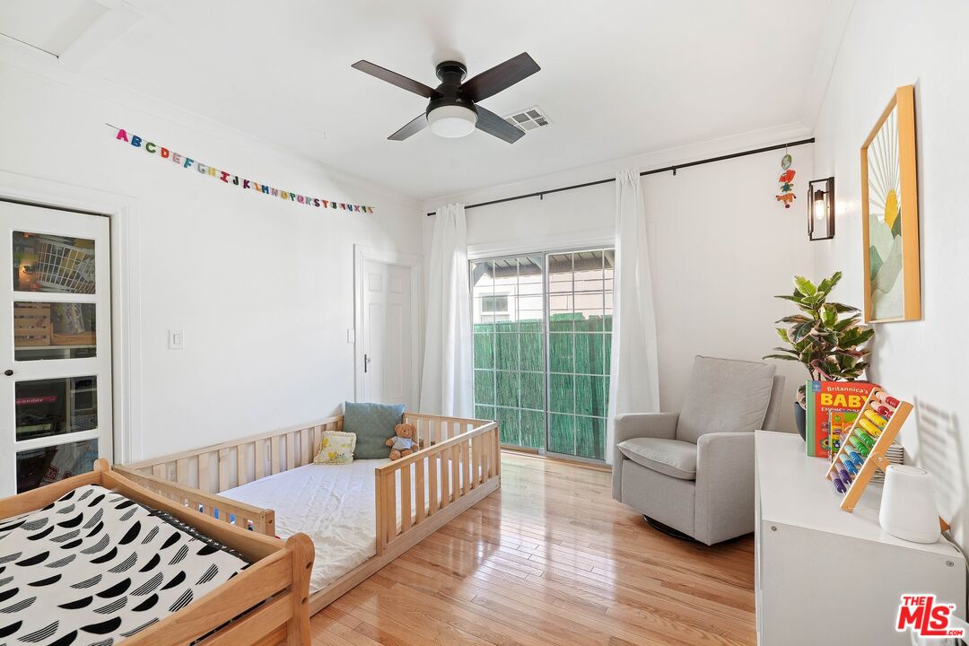 5159 Meridian Street Los Angeles, CA 90042 - Photo 19 of 41 a bedroom with furniture and a window