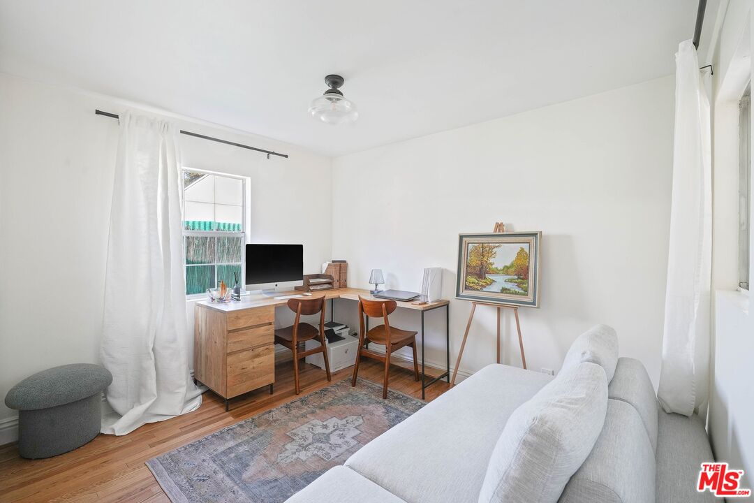 5159 Meridian Street Los Angeles, CA 90042 - Photo 20 of 41 a living room with furniture and a flat screen tv