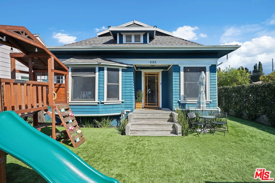 5159 Meridian Street Los Angeles, CA 90042 - Photo 2 of 41 a front view of a house with garden