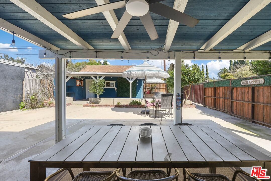 5159 Meridian Street Los Angeles, CA 90042 - Photo 24 of 41 a view of a patio with a table chairs and wooden floor