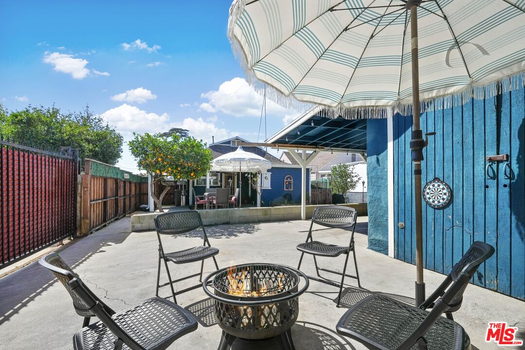 5159 Meridian Street Los Angeles, CA 90042 - Photo 31 of 41 a patio with a patio table and chairs