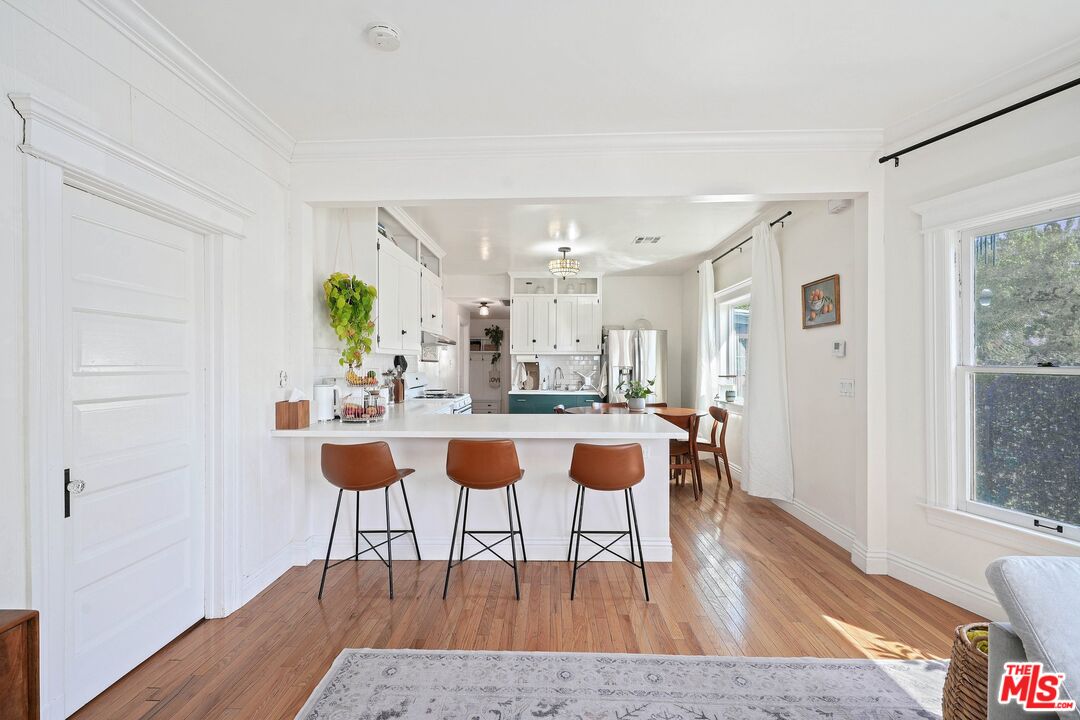 5159 Meridian Street Los Angeles, CA 90042 - Photo 8 of 41 a view of a dining room with furniture and wooden floor
