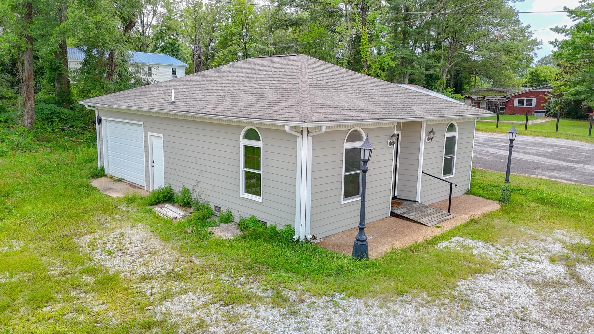 800 East Quitman Street Iuka, MS 38852 - Photo 2 of 7 a aerial view of a house next to a yard