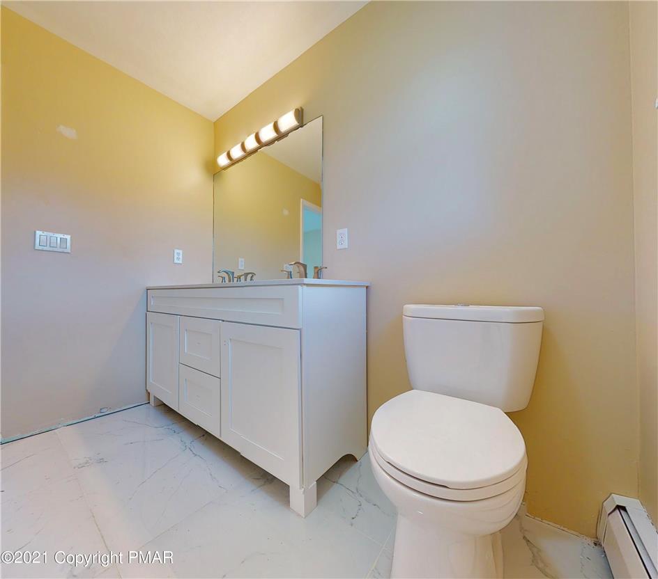 1110 Misty Ridge East Stroudsburg, PA 18302 - Photo 27 of 43 A well-appointed bathroom features a modern vanity and clean, marled floor tiling.