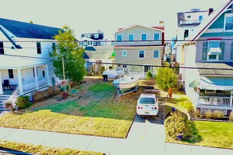 a aerial view of a house with a yard