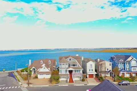an aerial view of a house with lake view