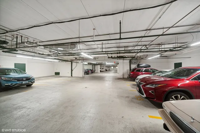 a view of parking garage with cars