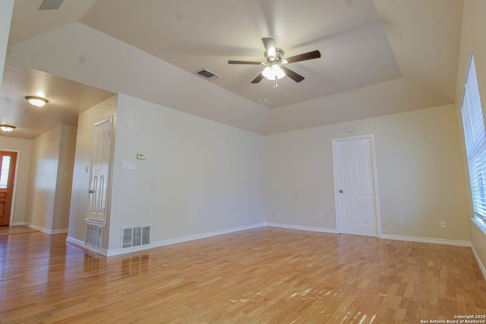 6703 Ridge Pl Street San Antonio, TX 78250 - Photo 12 of 44 a view of a livingroom with a chandelier fan