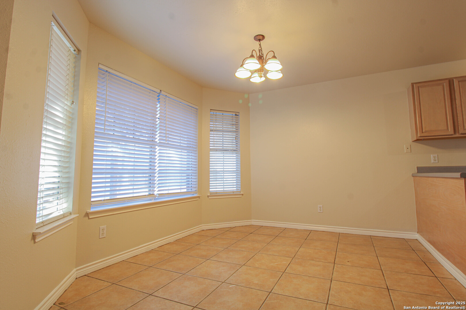 6703 Ridge Pl Street San Antonio, TX 78250 - Photo 13 of 44 a view of an empty room with a window