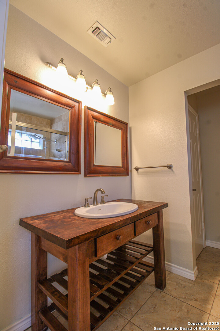 6703 Ridge Pl Street San Antonio, TX 78250 - Photo 25 of 44 a dining room with a table and chairs