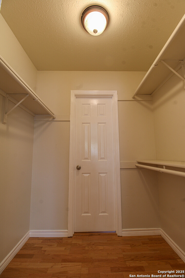 6703 Ridge Pl Street San Antonio, TX 78250 - Photo 27 of 44 a view of a room with wooden floor