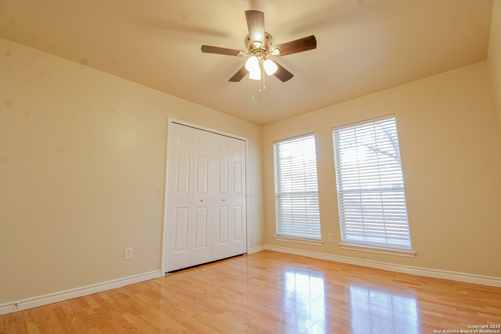 6703 Ridge Pl Street San Antonio, TX 78250 - Photo 34 of 44 a view of an empty room with wooden floor and a window