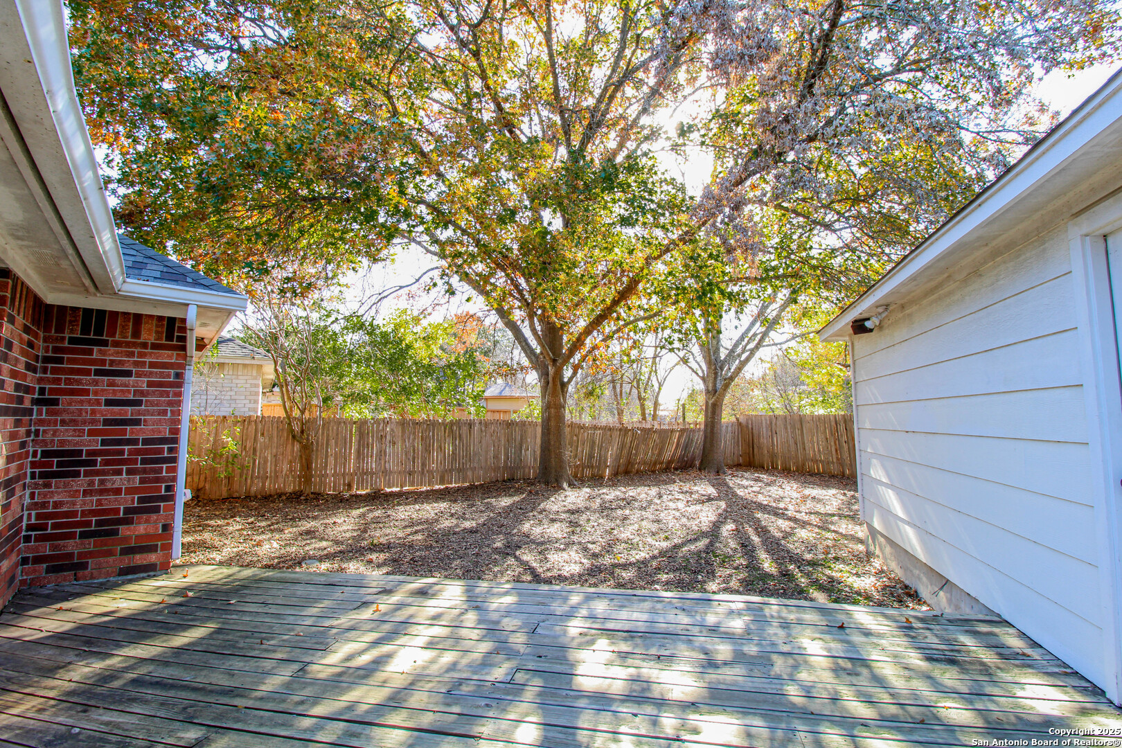 6703 Ridge Pl Street San Antonio, TX 78250 - Photo 37 of 44 a view of a backyard with a tree