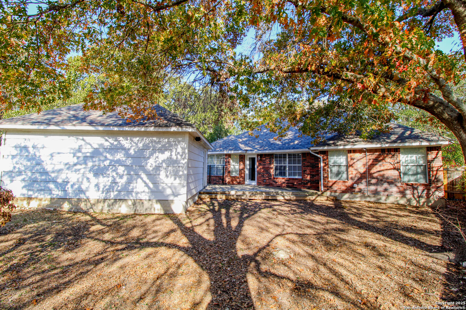 6703 Ridge Pl Street San Antonio, TX 78250 - Photo 39 of 44 a view of a house with a yard covered with snow in front of it