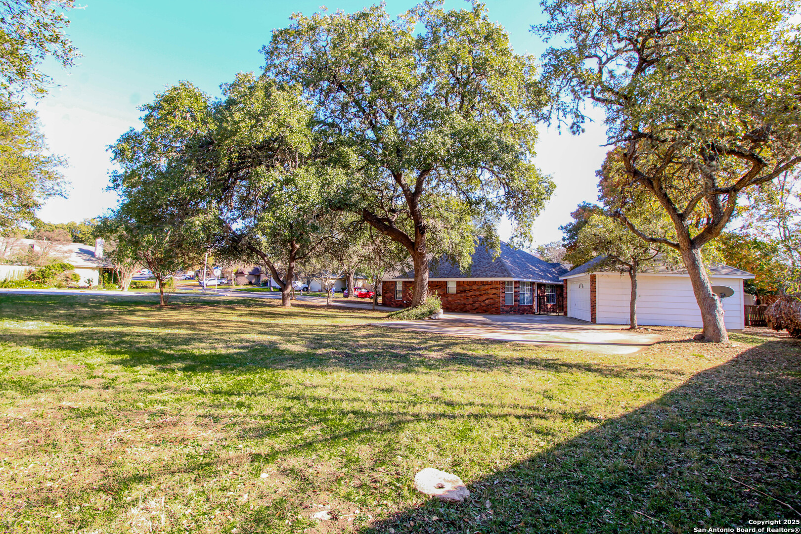 6703 Ridge Pl Street San Antonio, TX 78250 - Photo 40 of 44 a view of swimming pool with trees and yard